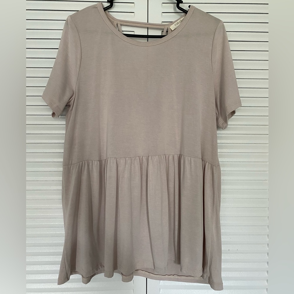 Beige blouse with open back